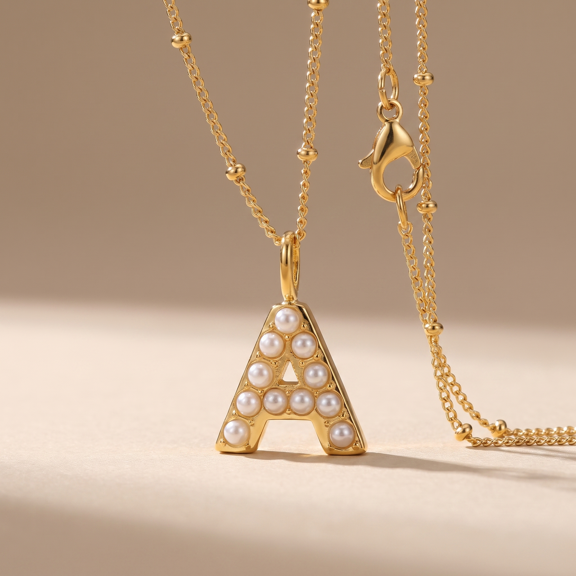 Asea Mother of Pearl Initial Necklace — close-up detail