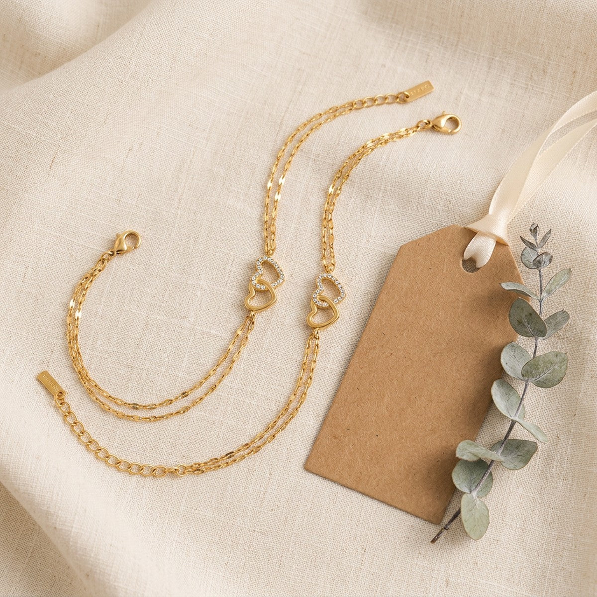Two Twin Hearts bracelets with a gift tag