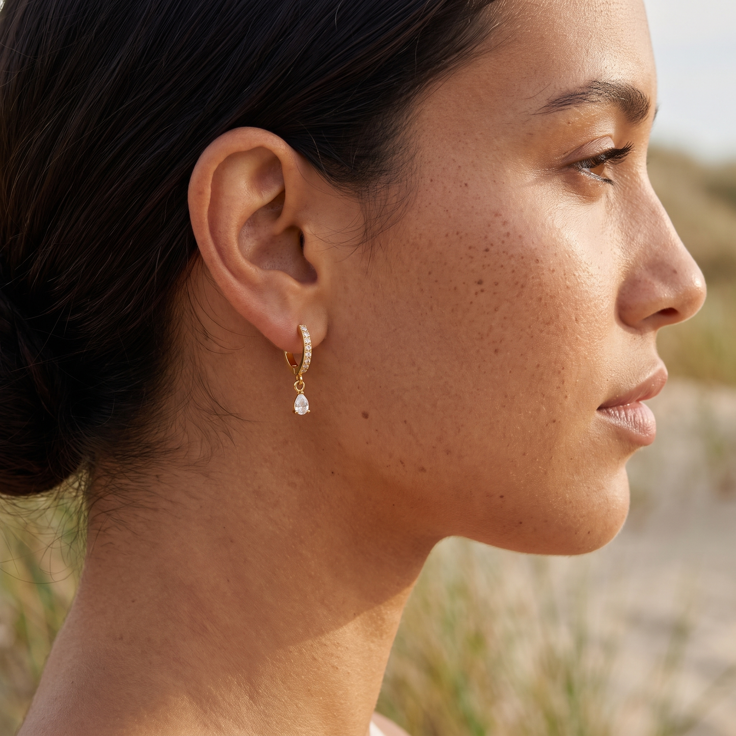 Asea Spark Huggie Hoops — worn by model