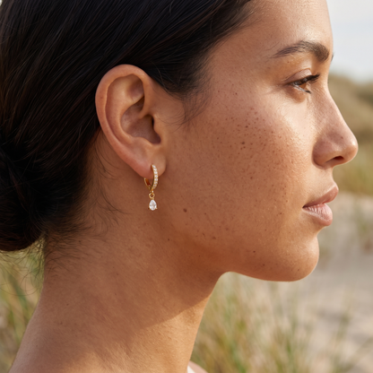 Asea Spark Huggie Hoops — worn by model