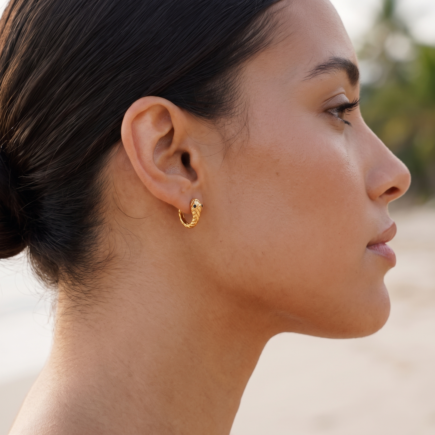 Asea Snake Huggie Hoops — worn by model