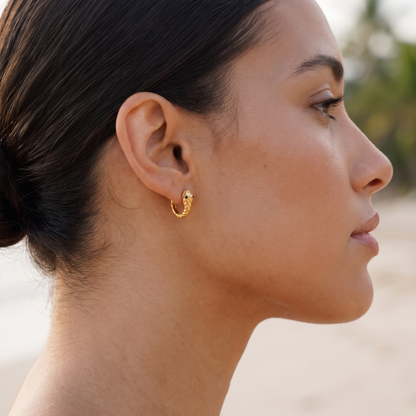 Asea Snake Huggie Hoops — worn by model