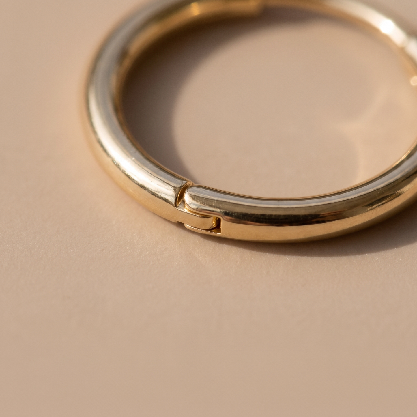 Asea Mini Huggie Earrings — close-up detail
