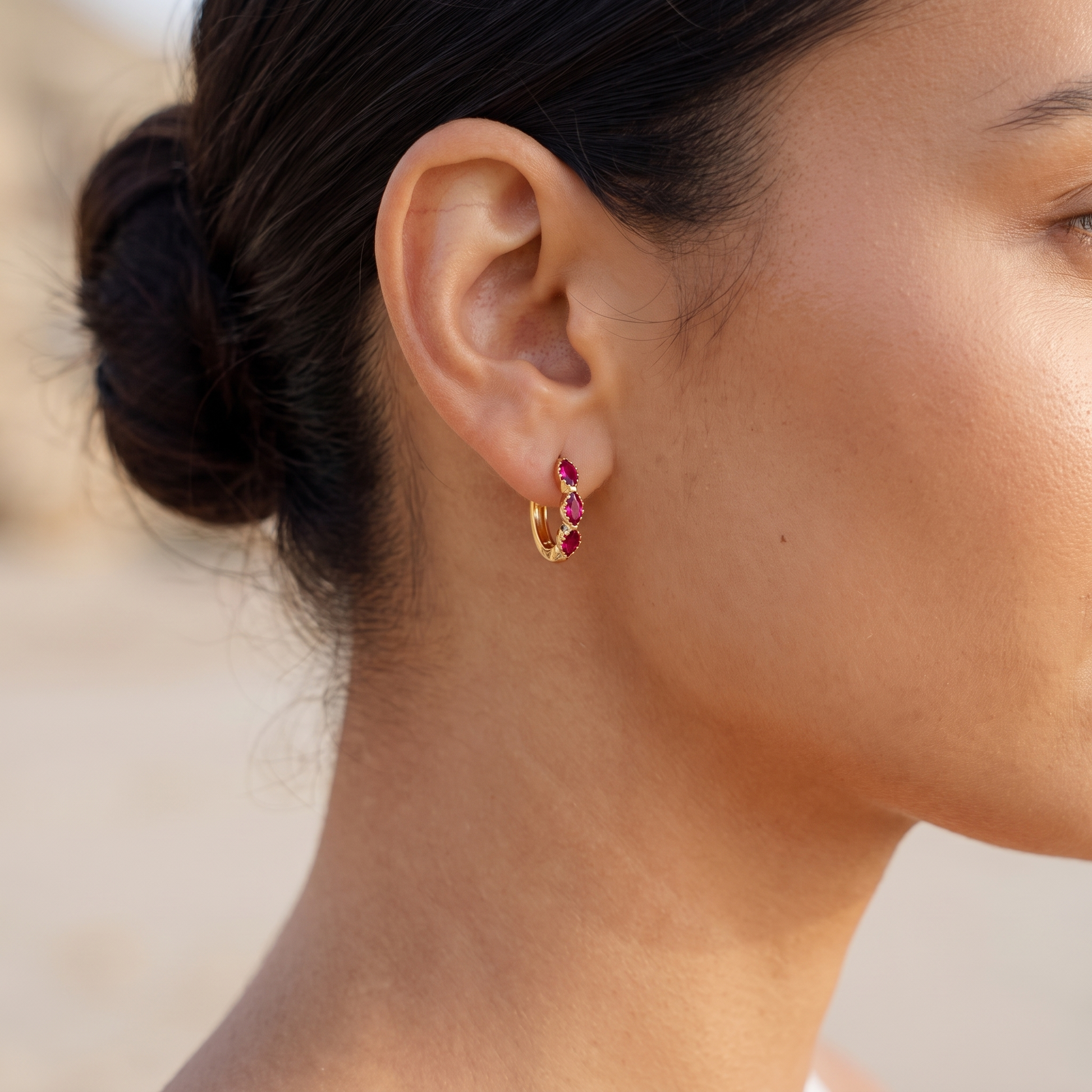 Asea Garnet Huggie Hoops — worn by model