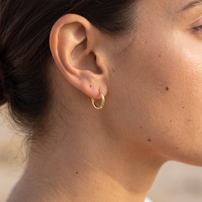 Asea Mini Huggie Earrings — worn by model