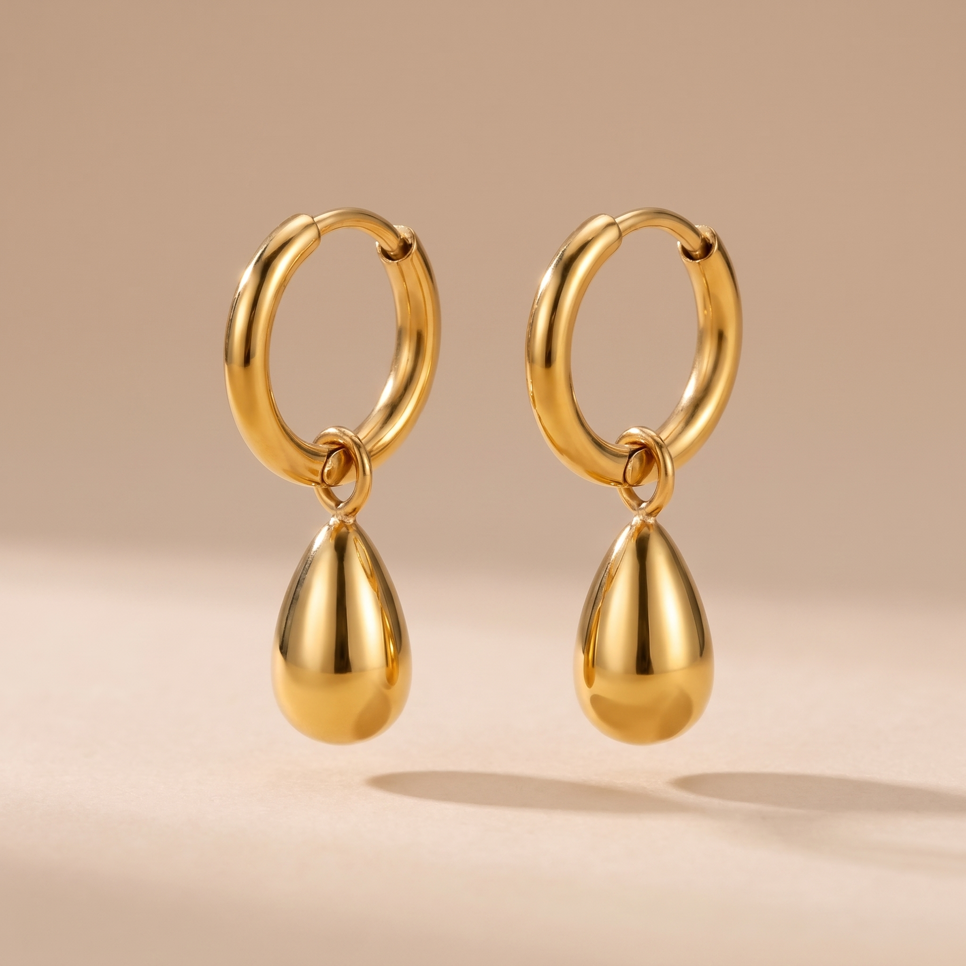 Asea Sculpted Drop Hoop Earrings — front view