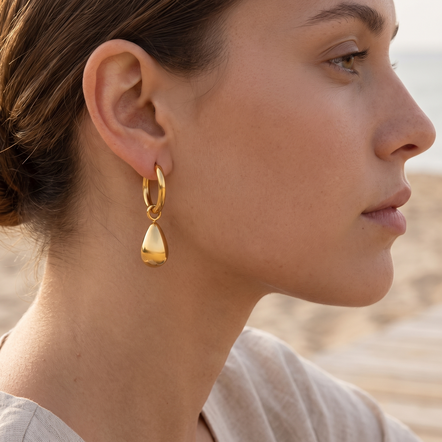 Asea Sculpted Drop Hoop Earrings — worn by model