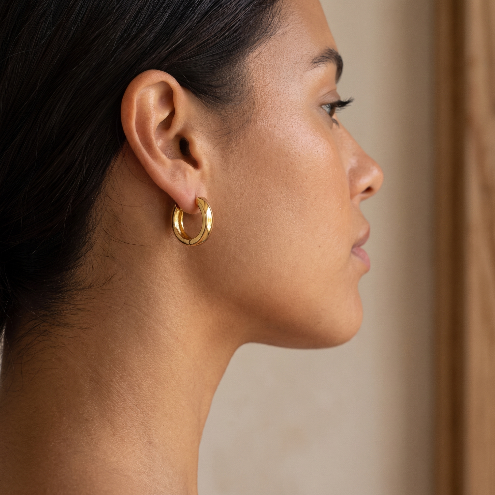 Asea Chunky Huggie Earrings — worn by model
