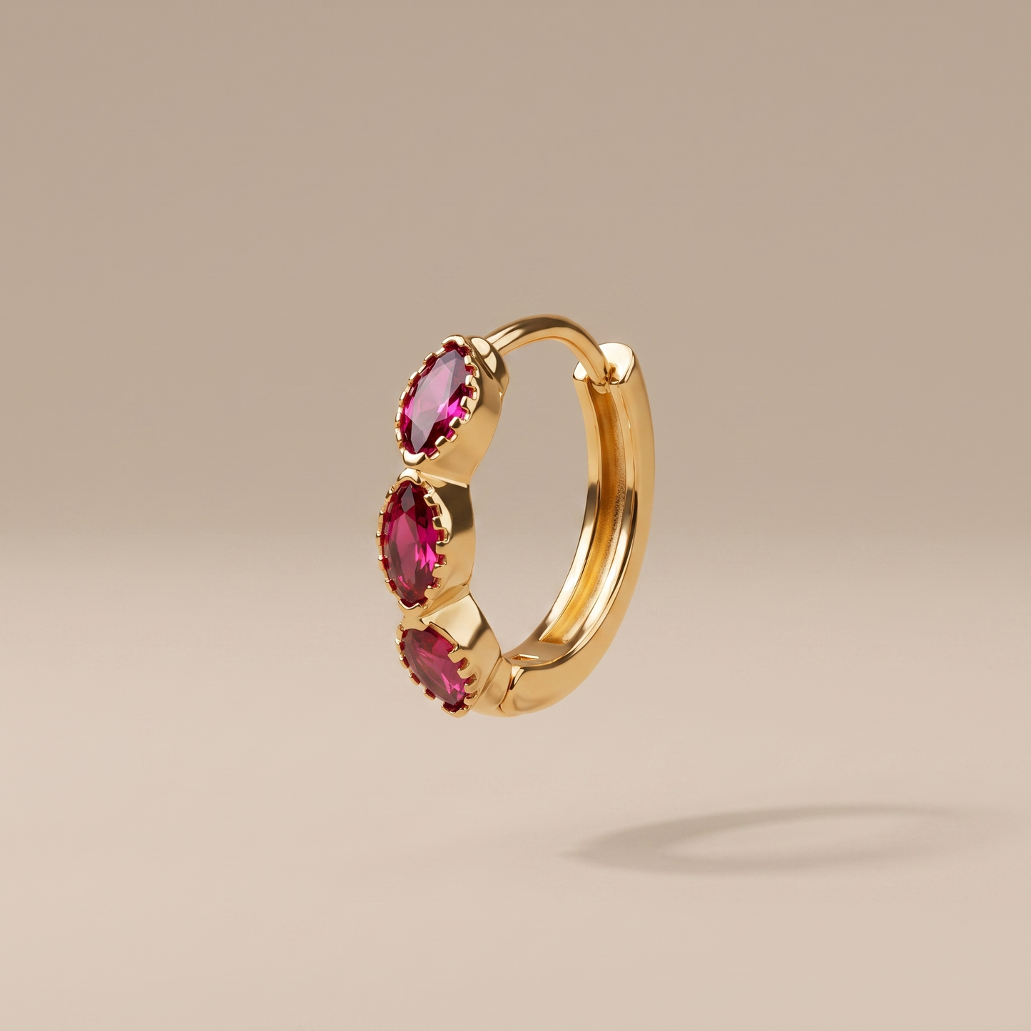 Asea Garnet Huggie Hoops — front view