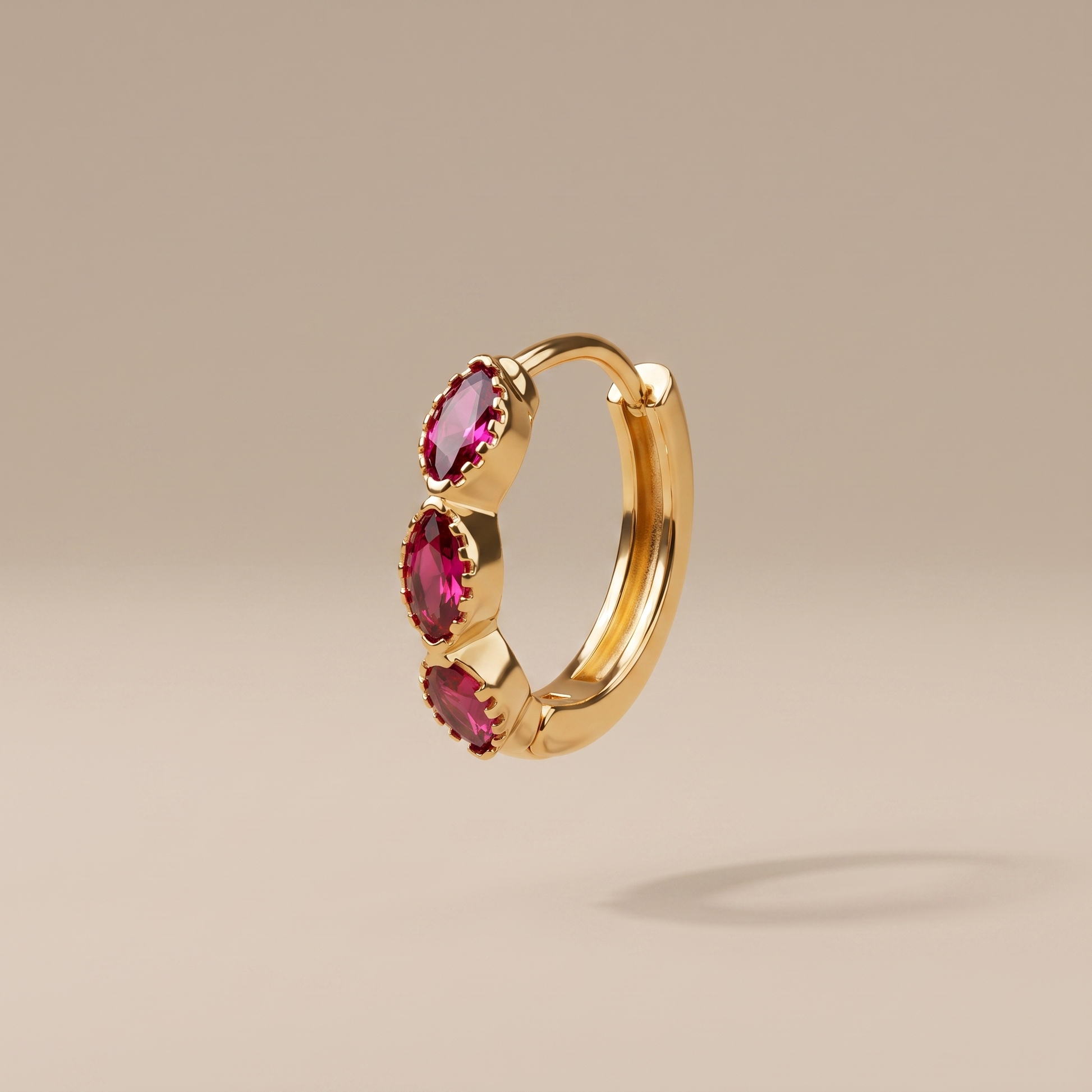 Asea Garnet Huggie Hoops — front view