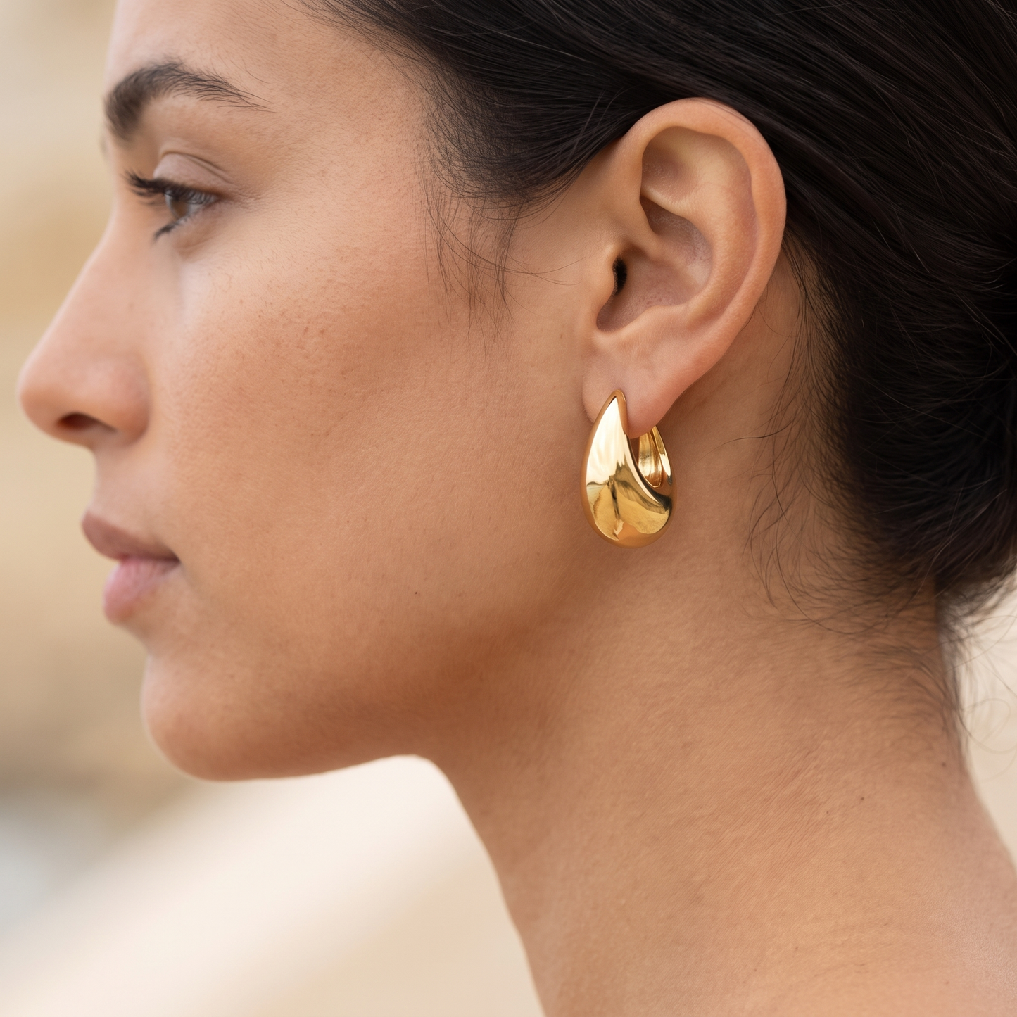 Asea Gold Teardrop Hoops — worn by model