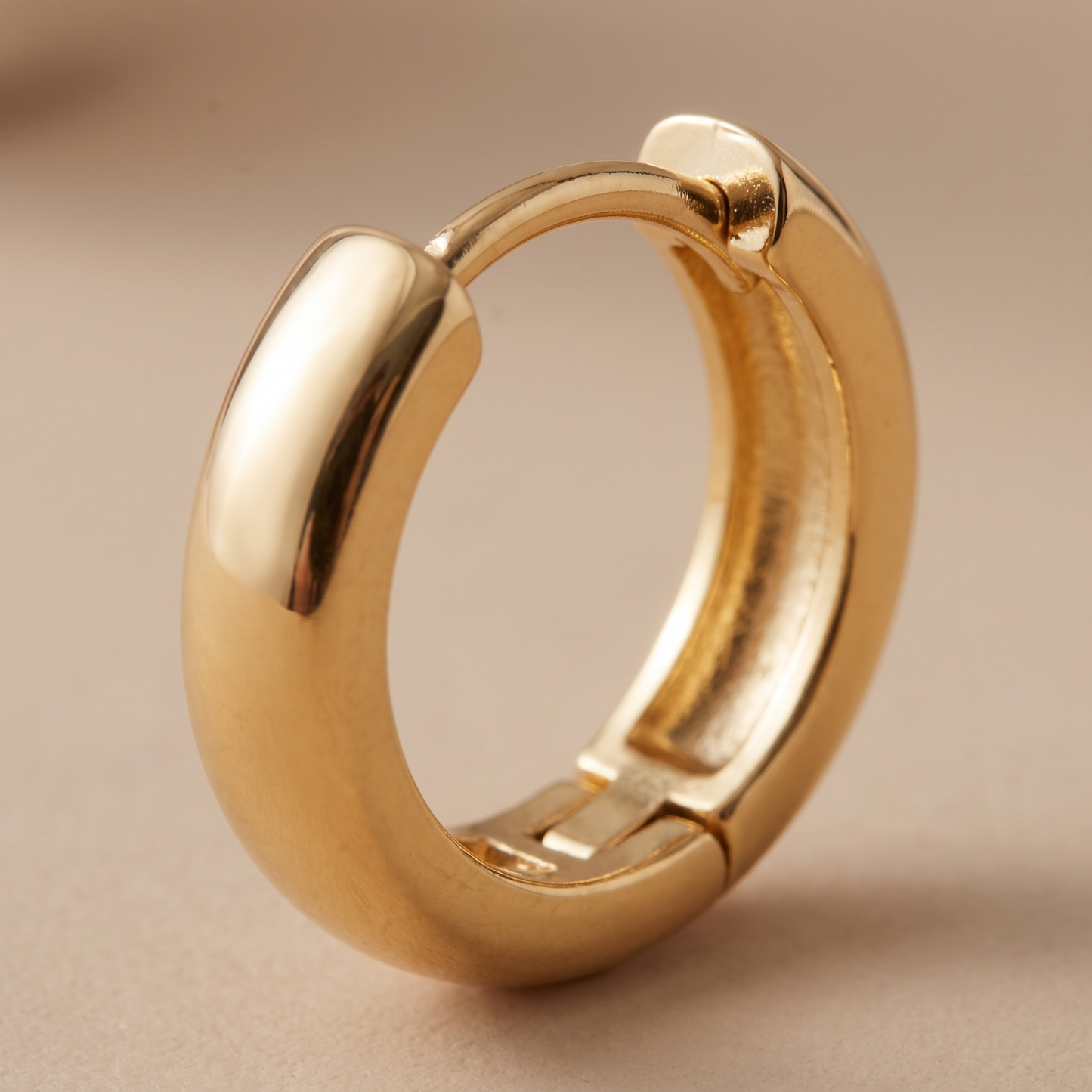 Asea Chunky Huggie Earrings — close-up detail