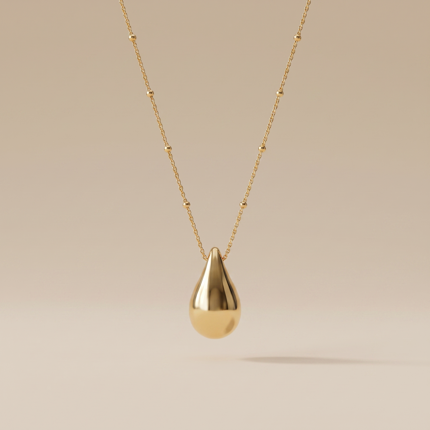 Asea Golden Drop Pendant Necklace — front view