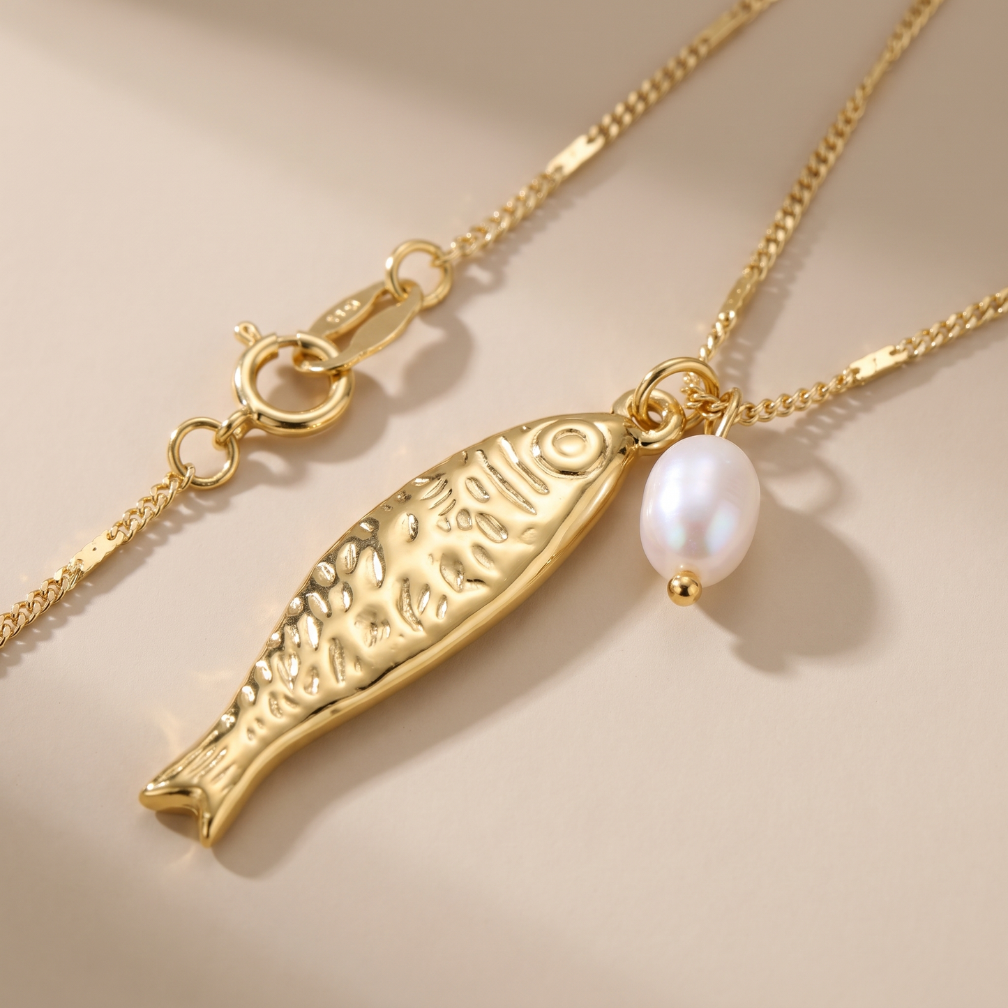 Asea Fish Charm Pearl Necklace — close-up detail