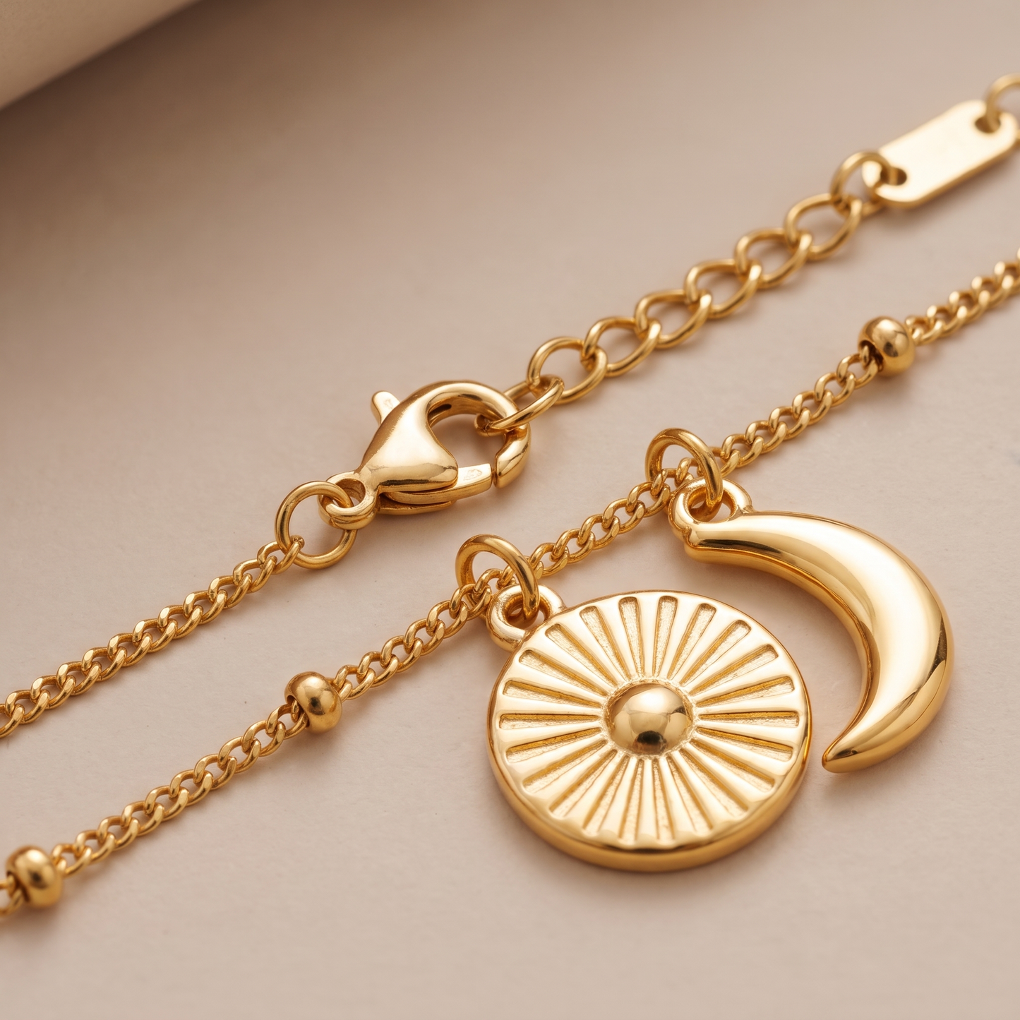 Asea Sun & Moon Charm Necklace — close-up detail