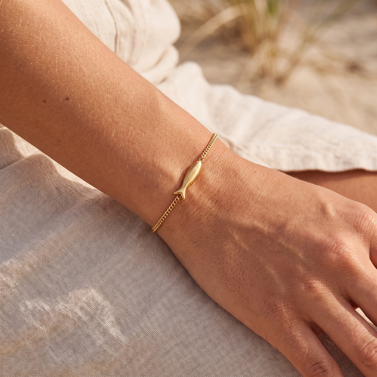 Asea Golden Fish Charm Bracelet — worn by model