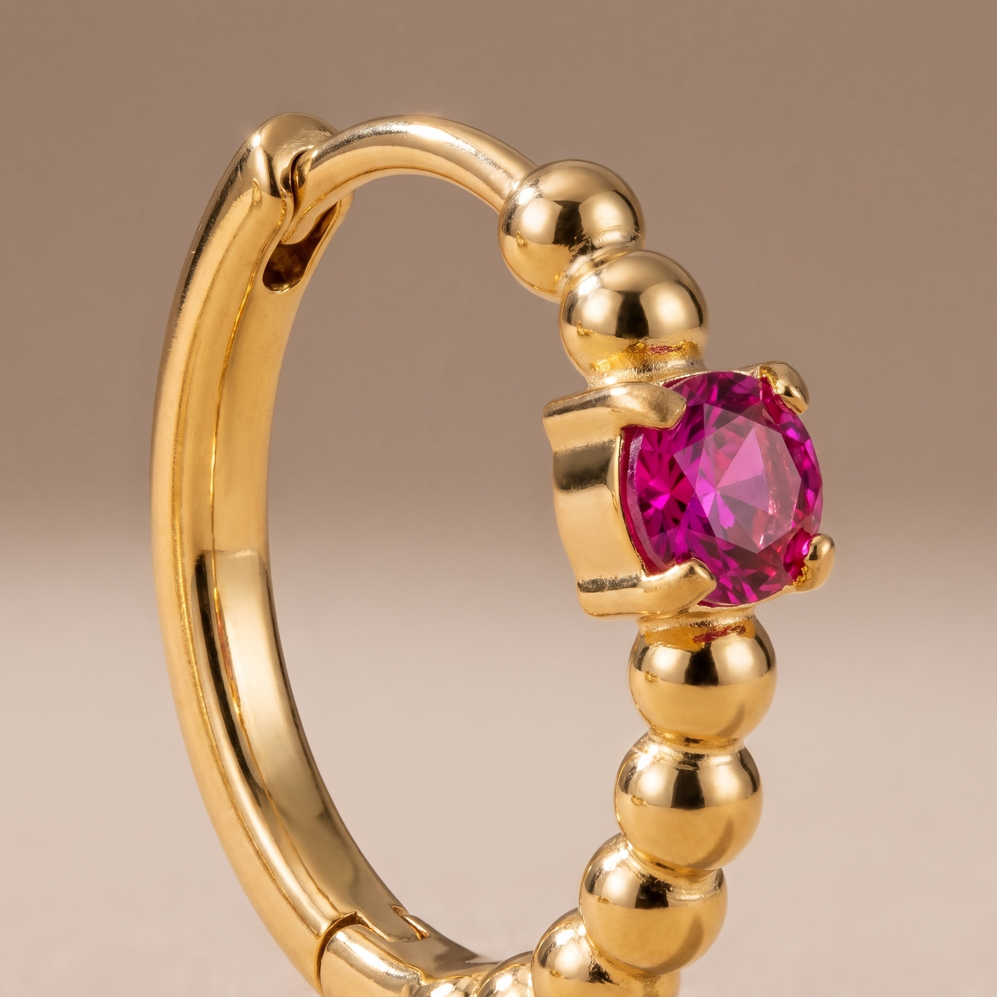 Asea Rosella Huggie Hoops — close-up detail