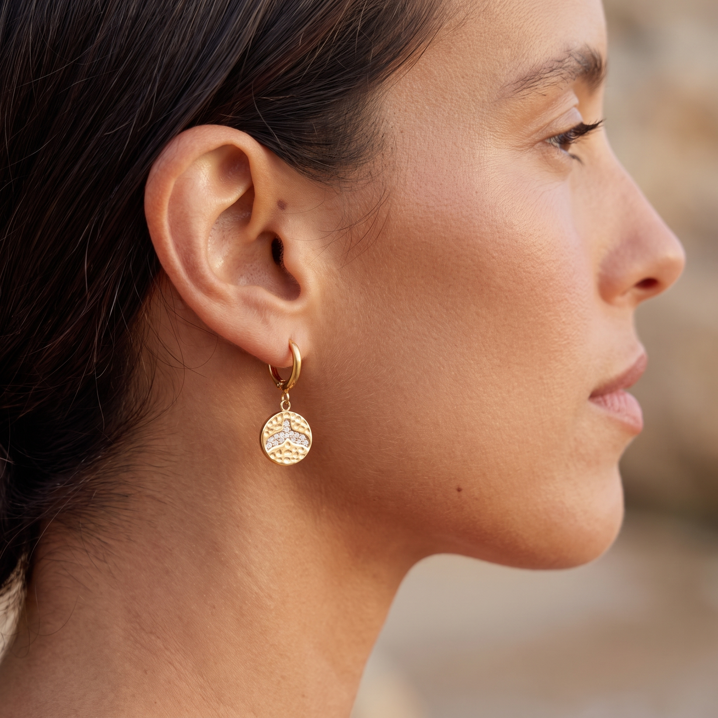 Asea Whale Tail Huggie Earrings — worn by model