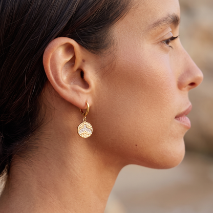 Asea Whale Tail Huggie Earrings — worn by model