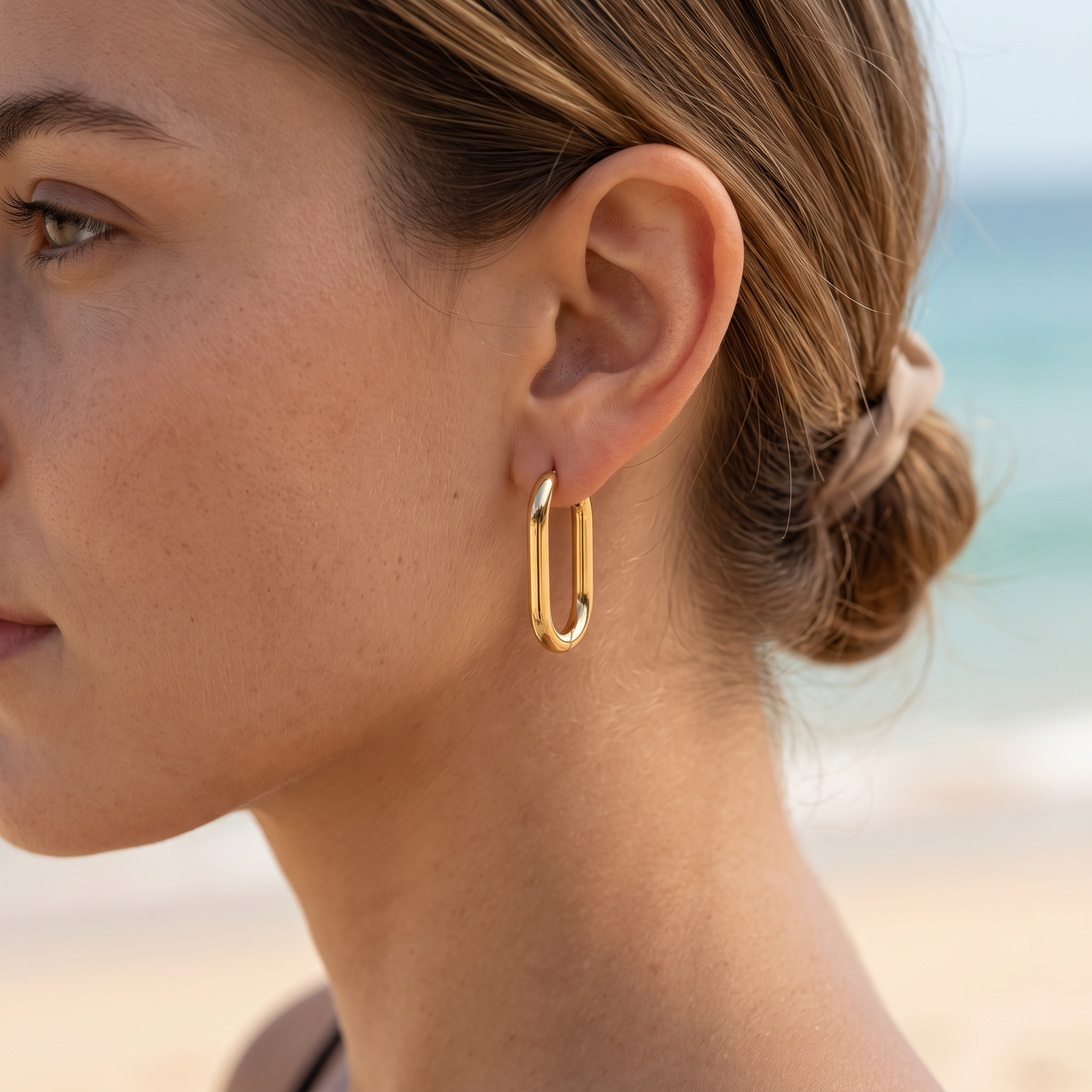 Asea Gold Oval Hoops — worn by model